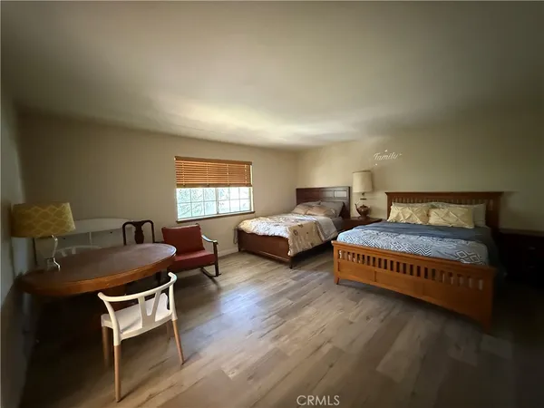 a bedroom with bed and a window