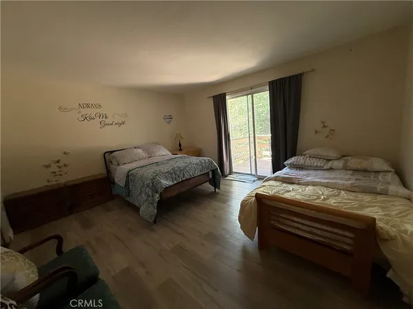 a spacious bedroom with a bed and window