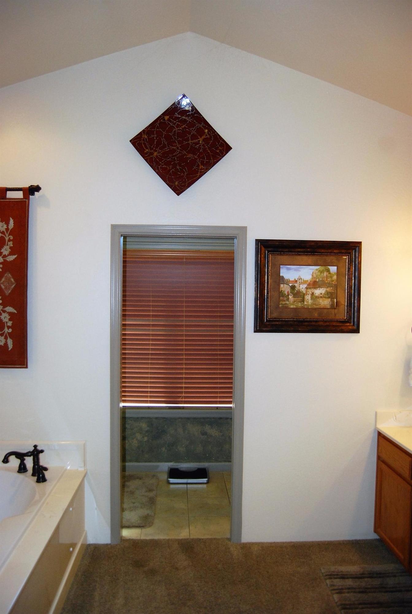 1136 Grouse Ridge Drive Central Point, OR 97502 - Photo 17 of 35 a view of an empty room with a window