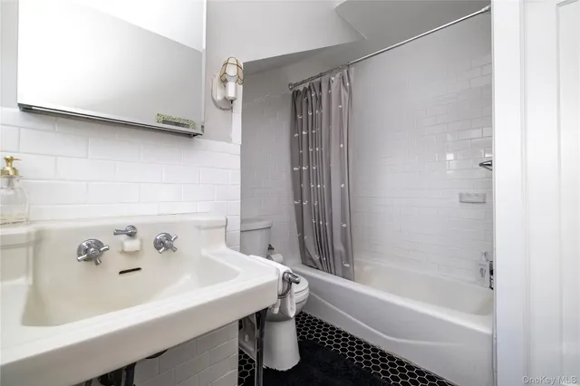 a bathroom with a bathtub and a sink