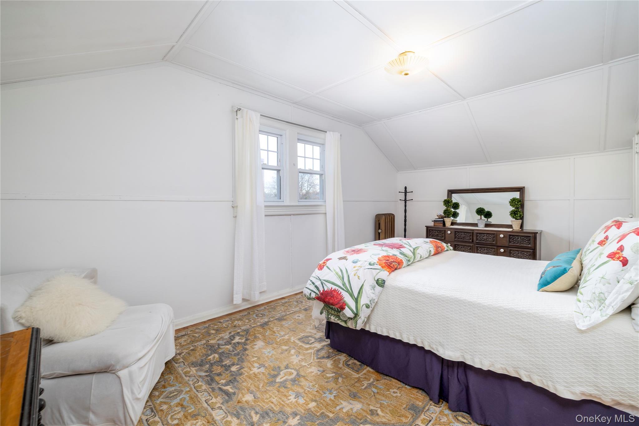 232 Sherman Street Lynbrook, NY 11563 - Photo 19 of 22 a bedroom with a bed and window