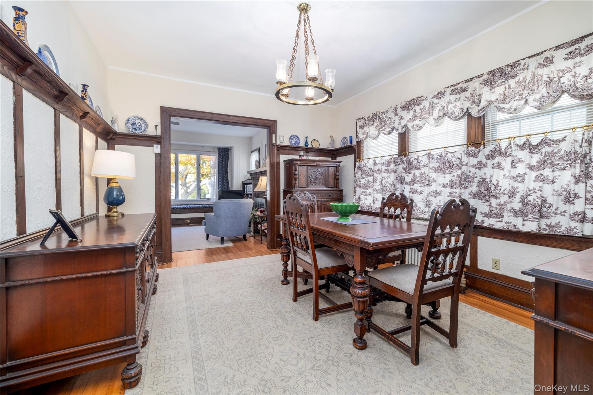 232 Sherman Street Lynbrook, NY 11563 - Photo 8 of 22 a view of a dining room with furniture and a chandelier