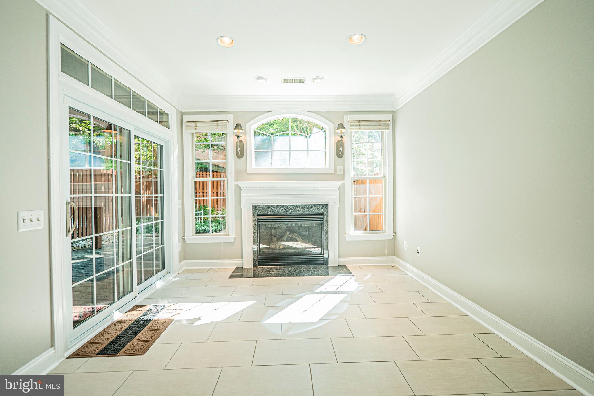5448 Edsall Ridge Place Alexandria, VA 22312 - Photo 39 of 52 a view of an empty room with a fireplace and a window