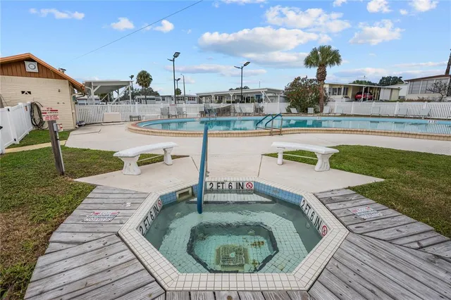 a house view with a swimming pool