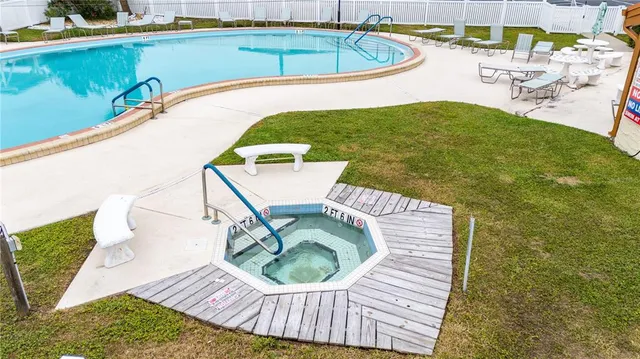 a view of a swimming pool with a patio