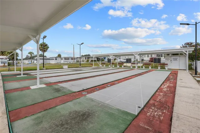 a view of swimming pool with a chairs