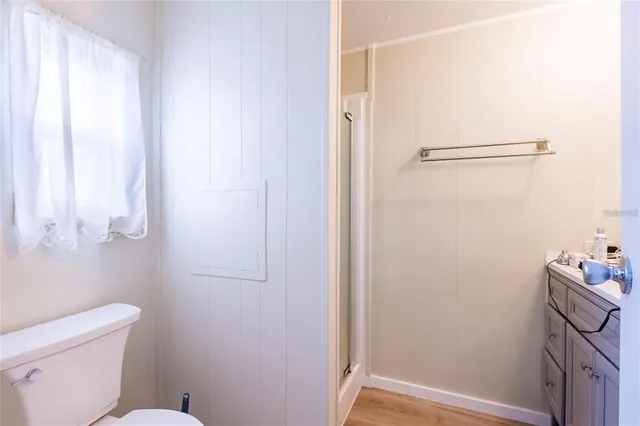 a bathroom with a toilet and shower