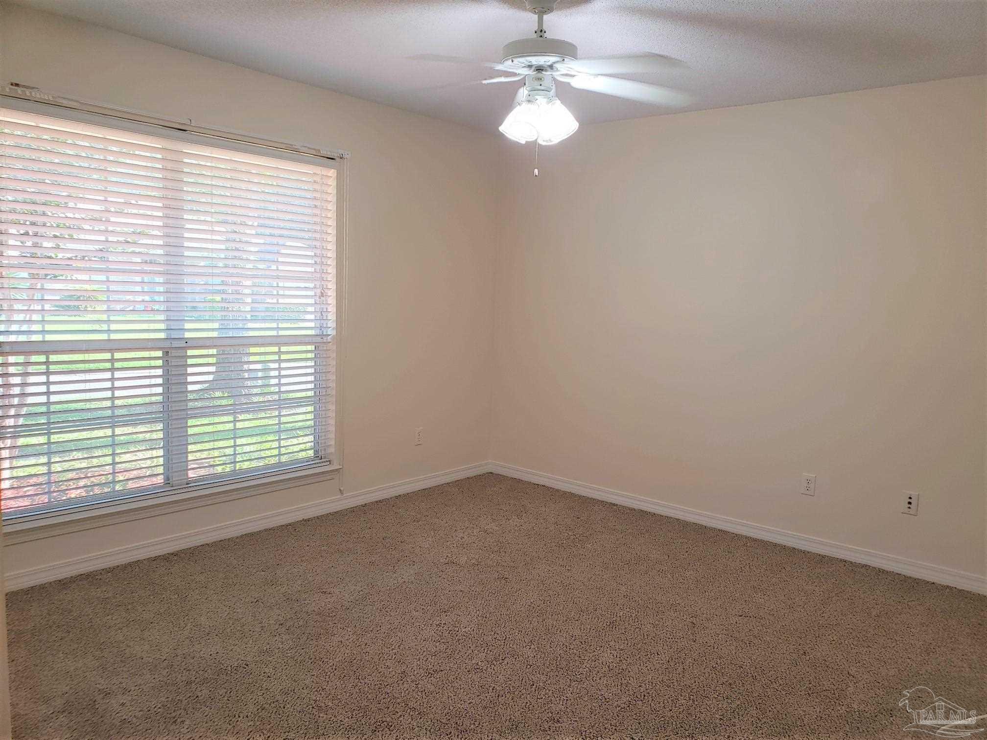 1767 Condor Drive Cantonment, FL 32533 - Photo 12 of 14 an empty room with a window