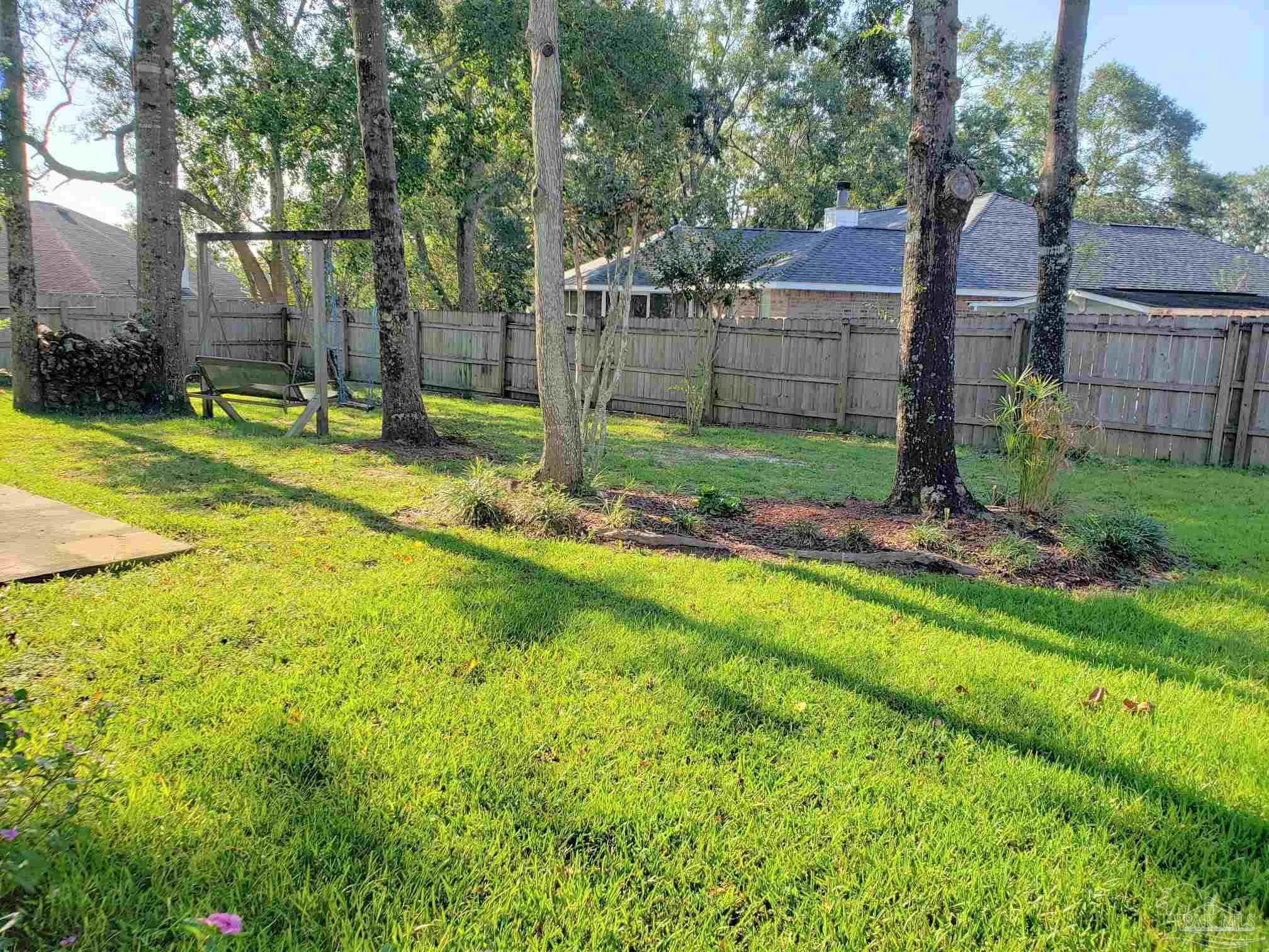 1767 Condor Drive Cantonment, FL 32533 - Photo 14 of 14 a view of a backyard with a small cabin