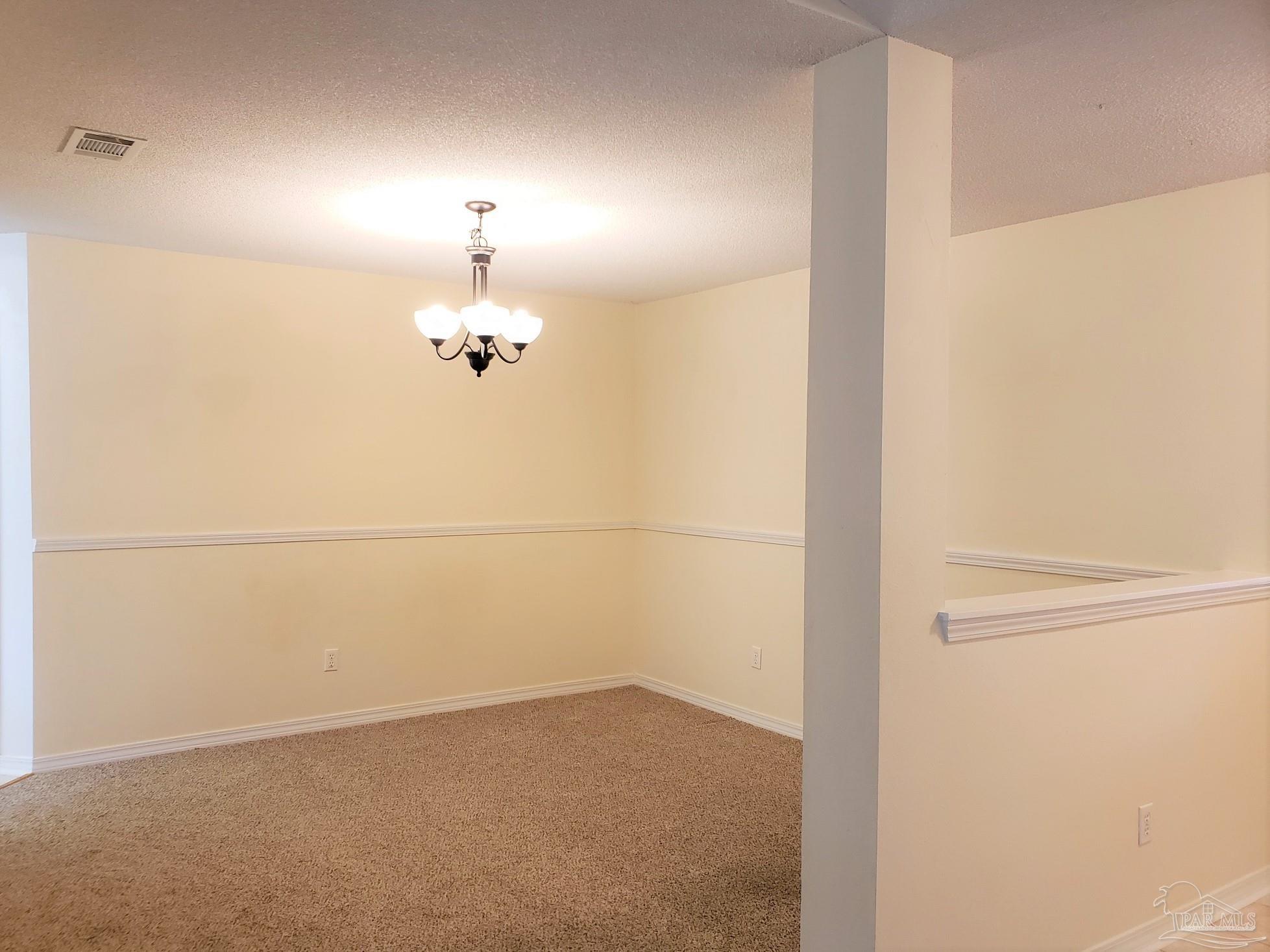 1767 Condor Drive Cantonment, FL 32533 - Photo 6 of 14 a view of a chandelier fan