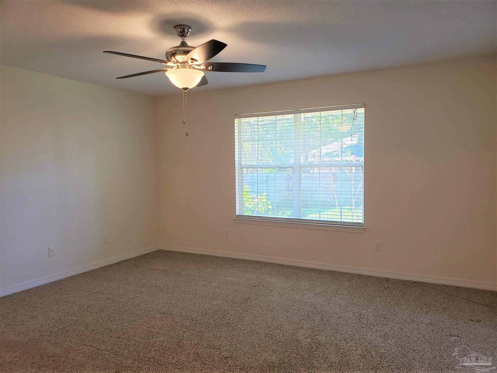 1767 Condor Drive Cantonment, FL 32533 - Photo 7 of 14 an empty room with a window