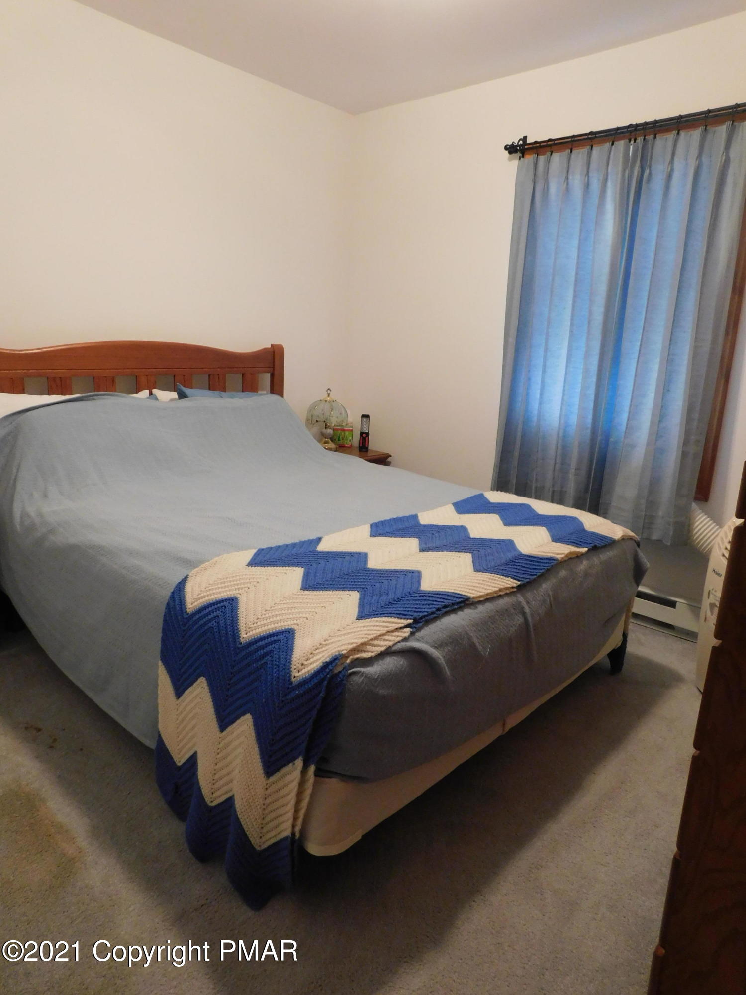 1051 Hampstead Road Bushkill, PA 18324 - Photo 19 of 40 a bedroom with a bed and dresser