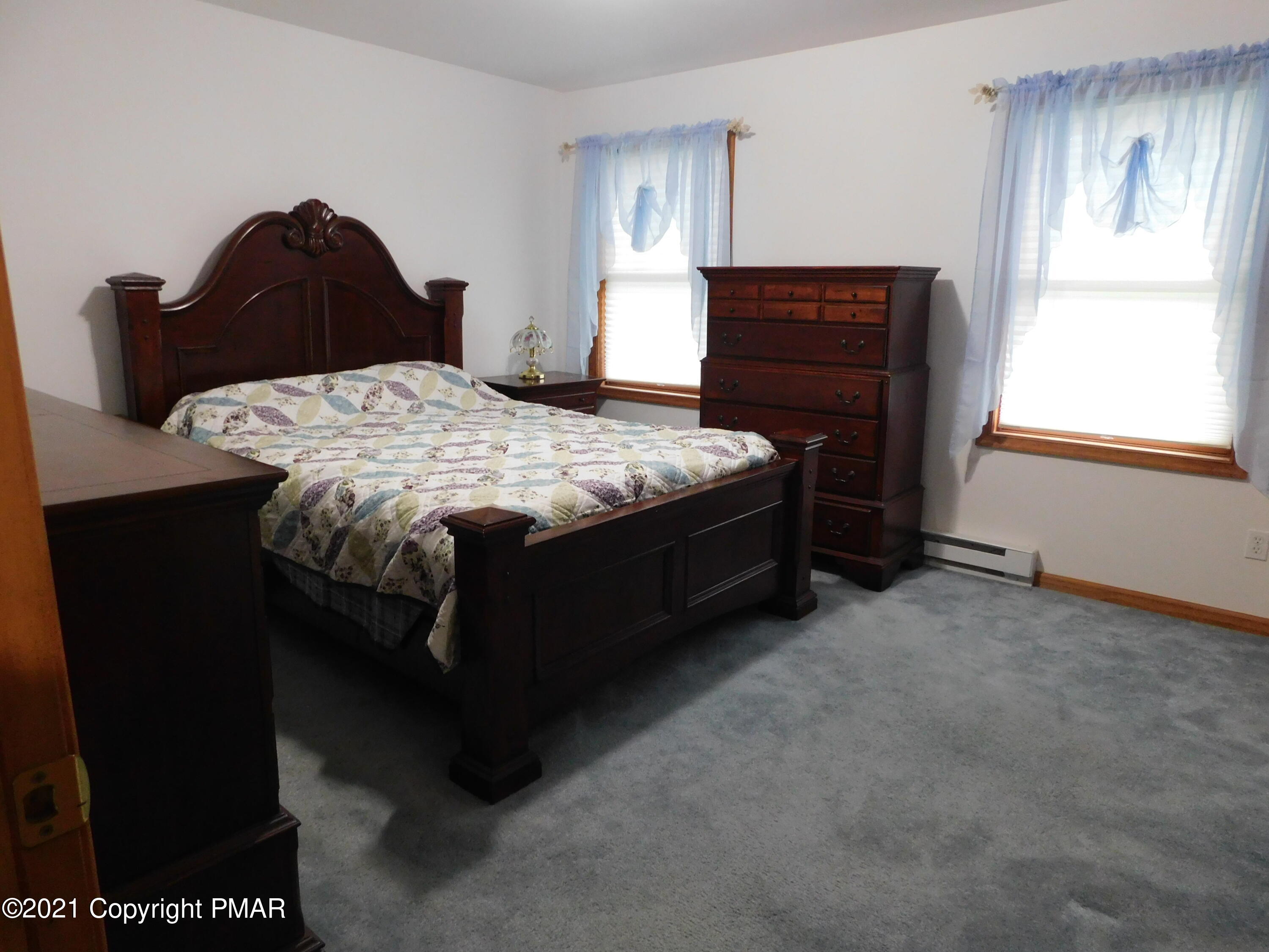 1051 Hampstead Road Bushkill, PA 18324 - Photo 5 of 40 a bedroom with a bed and a window