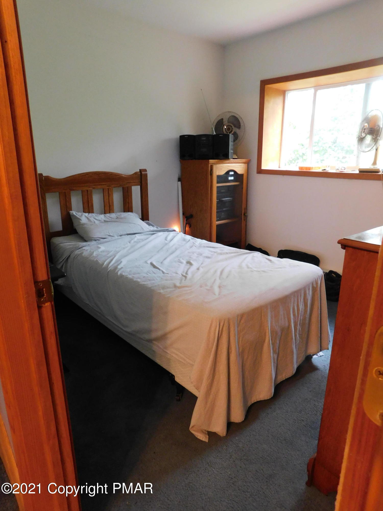 1051 Hampstead Road Bushkill, PA 18324 - Photo 8 of 40 a bedroom with a bed and a window