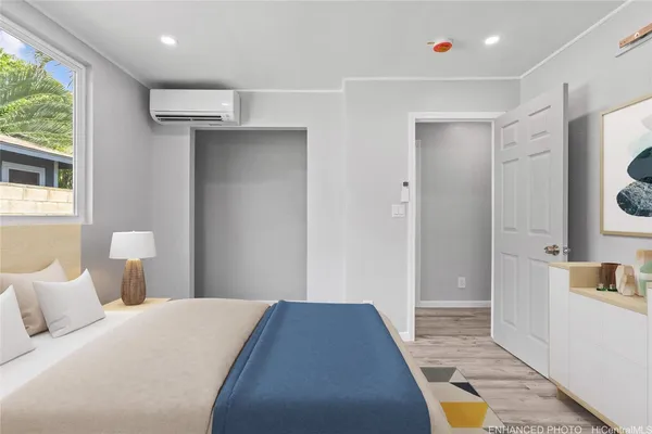 a bedroom with a bed and a mirror