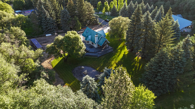 10686 South Covered Brg Cyn Road, Unit 14 Spanish Fork, UT 84660 - Photo 13 of 44 Expansive property featuring a multi-story residence with a green roof, surrounded by mature evergreen and deciduous trees