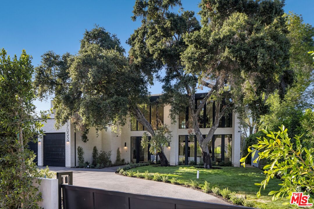 17055 Rancho Street Encino, CA 91316 - Photo 13 of 73 front view of house with a yard