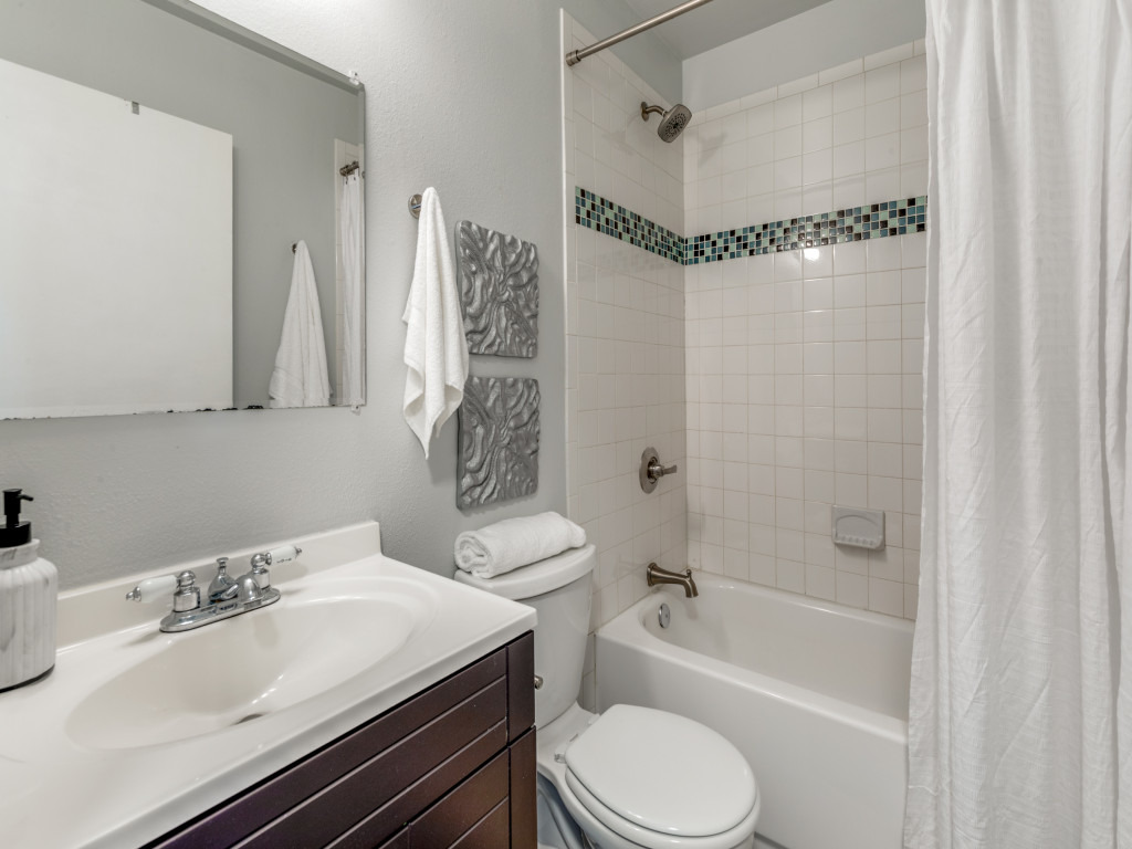 1705 Adriane Drive Austin, TX 78721 - Photo 12 of 31 a bathroom with a sink toilet and shower