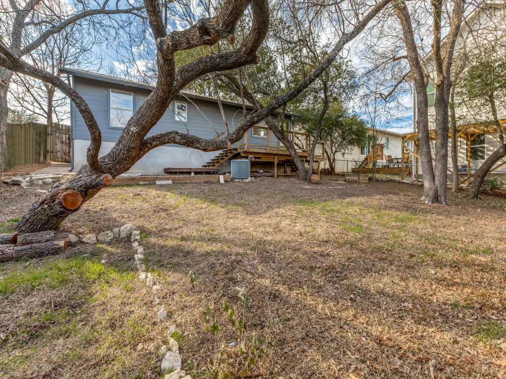 1705 Adriane Drive Austin, TX 78721 - Photo 19 of 31 a view of a yard with a tree