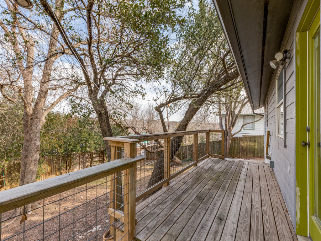 1705 Adriane Drive Austin, TX 78721 - Photo 22 of 31 a view of balcony with wooden floor and fence