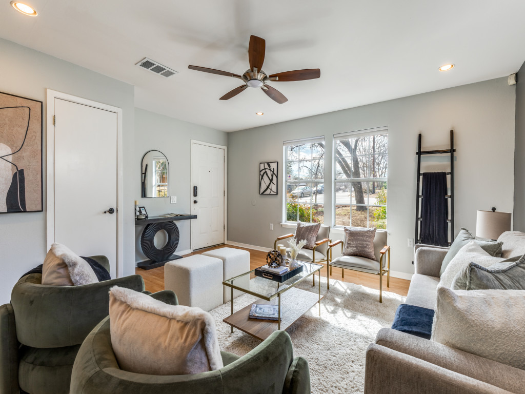 1705 Adriane Drive Austin, TX 78721 - Photo 3 of 31 a living room with furniture and a fireplace