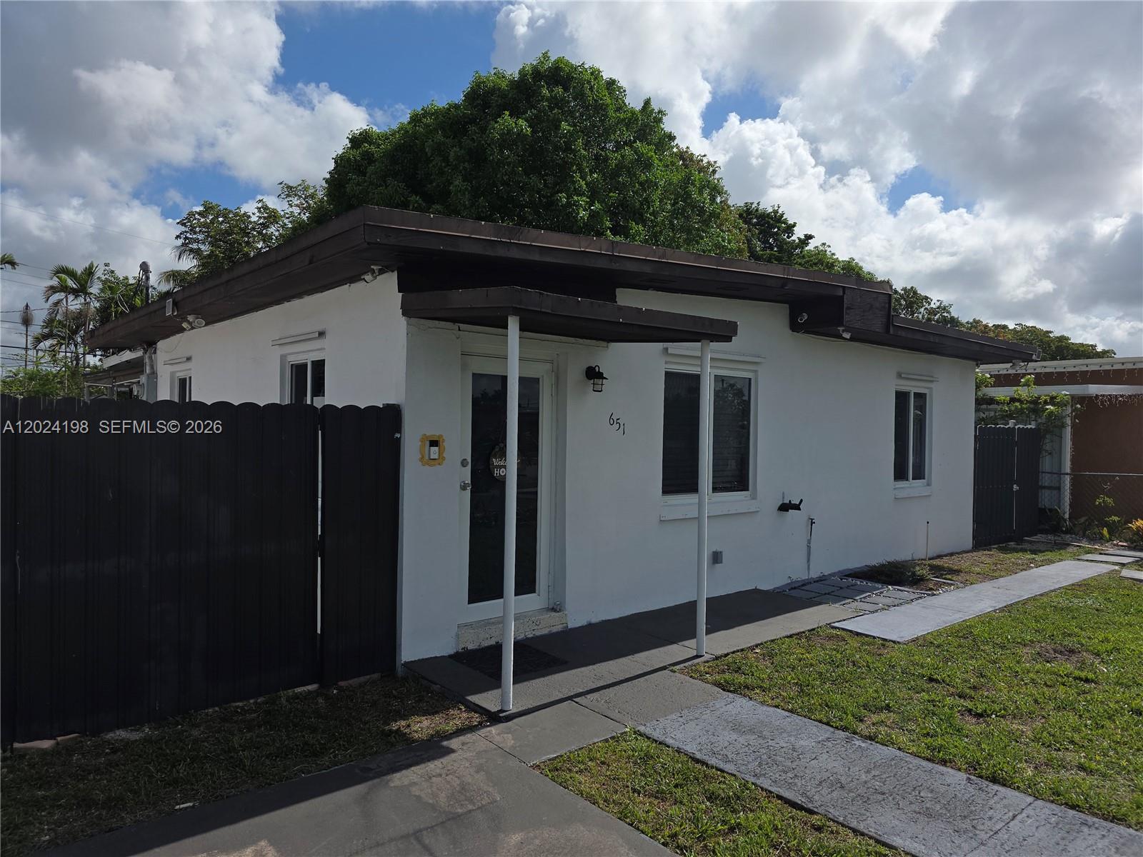 651 East 48th Street Hialeah, FL 33013 - Photo 4 of 52 a view of a house with backyard