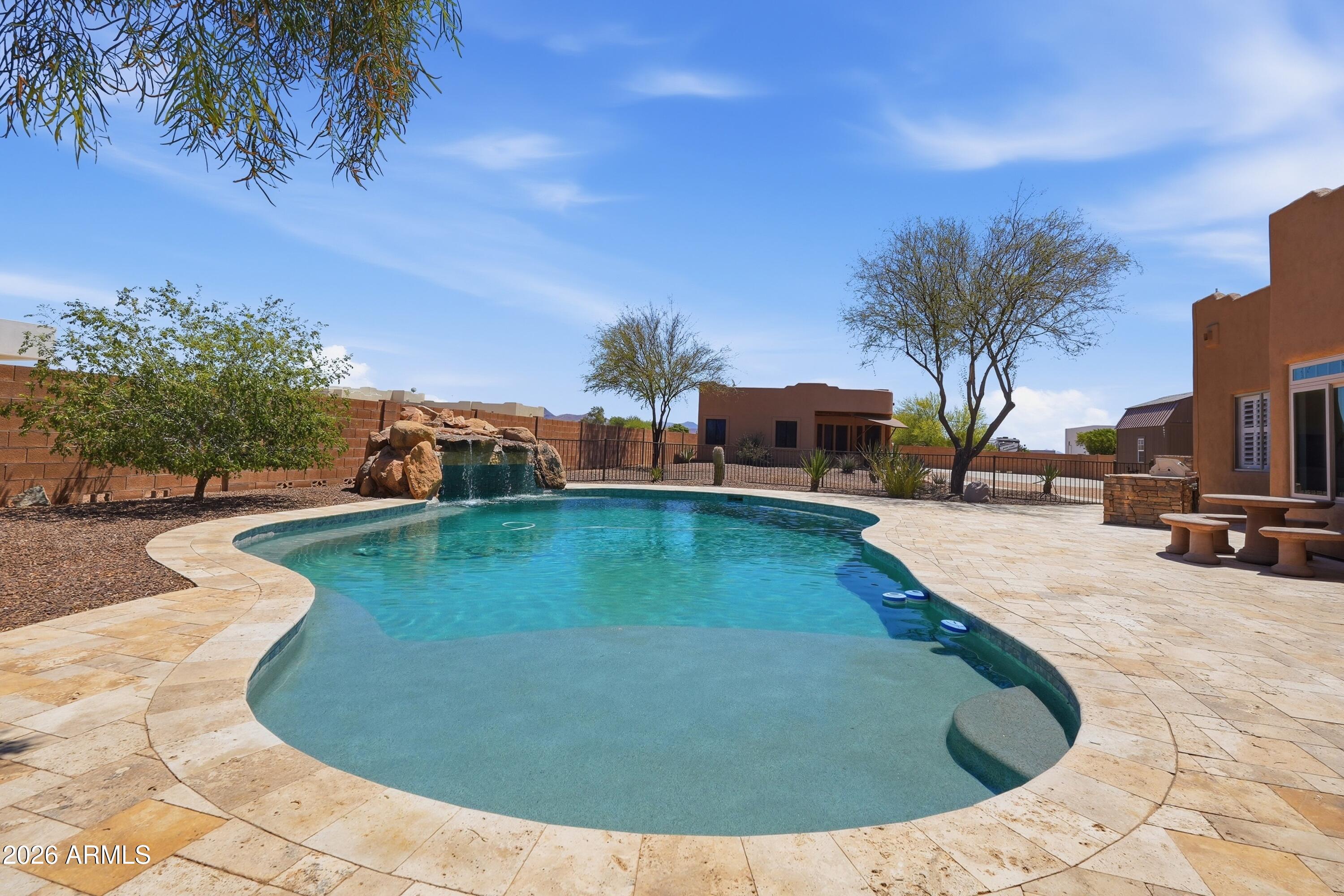 2616 West Canyon Road Phoenix, AZ 85086 - Photo 30 of 45 a view of a swimming pool with a patio