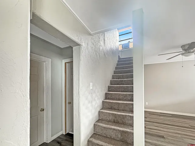 a view of an entryway with wooden floor