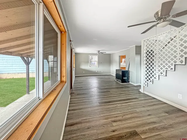 a view of outdoor space with wooden floor and windows