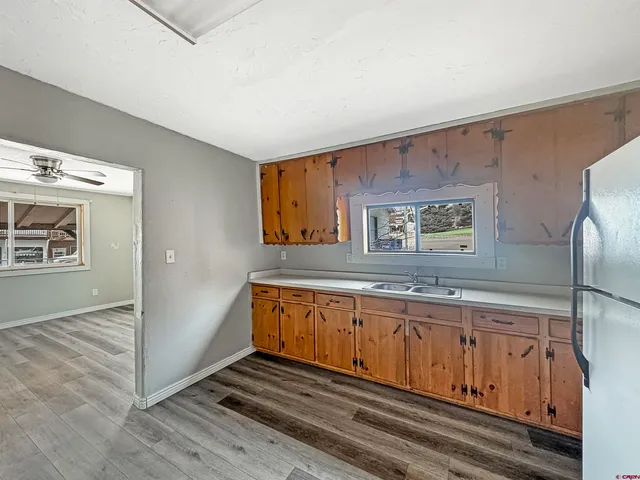 a bathroom with a sink a mirror and a shower