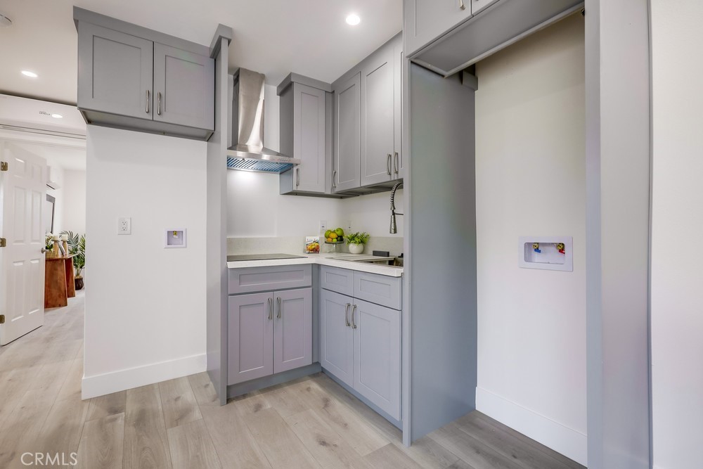 6441 A Mohawk Road Westminster, CA 92683 - Photo 12 of 15 a kitchen with stainless steel appliances granite countertop a refrigerator and a sink
