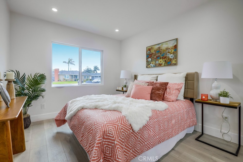 6441 A Mohawk Road Westminster, CA 92683 - Photo 13 of 15 a bedroom with bed and a potted plant