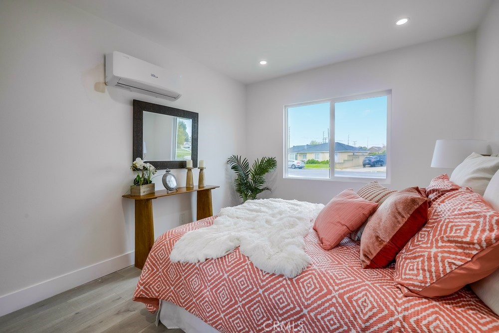 6441 A Mohawk Road Westminster, CA 92683 - Photo 14 of 15 a bedroom with a bed and window