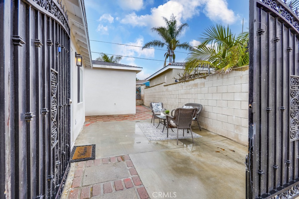 6441 A Mohawk Road Westminster, CA 92683 - Photo 4 of 15 a backyard of a house with table and chairs