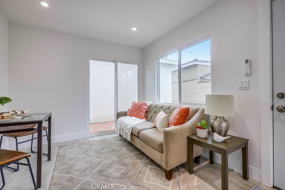 6441 A Mohawk Road Westminster, CA 92683 - Photo 10 of 15 a living room with furniture and a potted plant