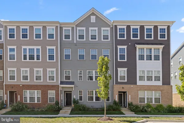 a front view of a building with yard