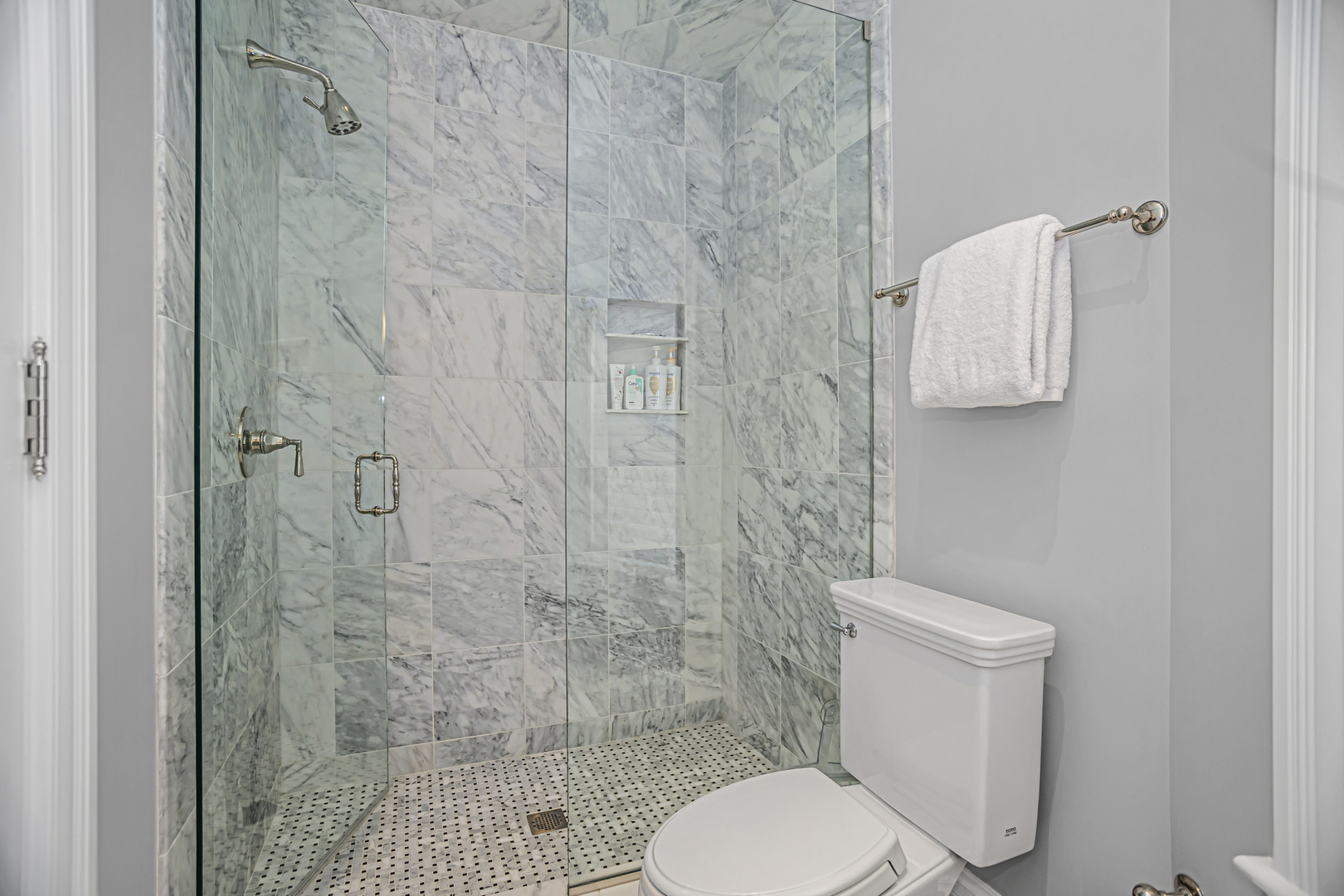 1302 North Ritchie Court Chicago, IL 60610 - Photo 13 of 31 a white toilet sitting next to a shower