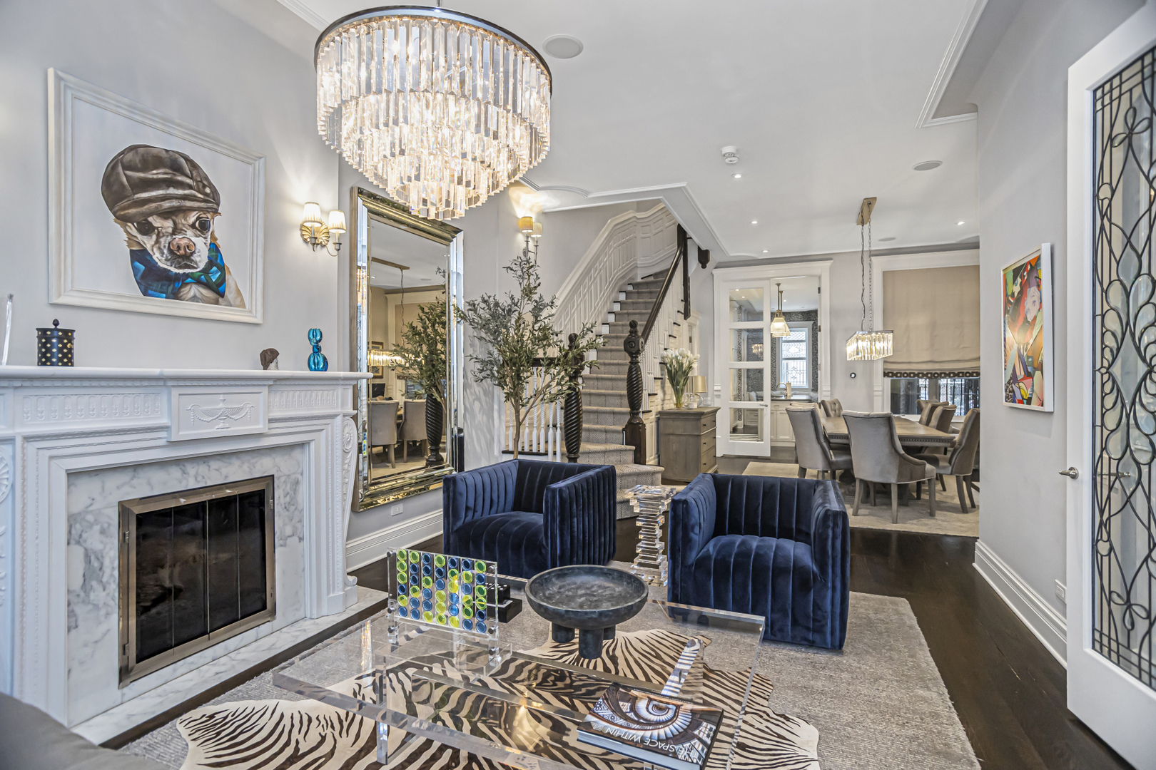 1302 North Ritchie Court Chicago, IL 60610 - Photo 4 of 31 a living room with furniture a chandelier and a fireplace