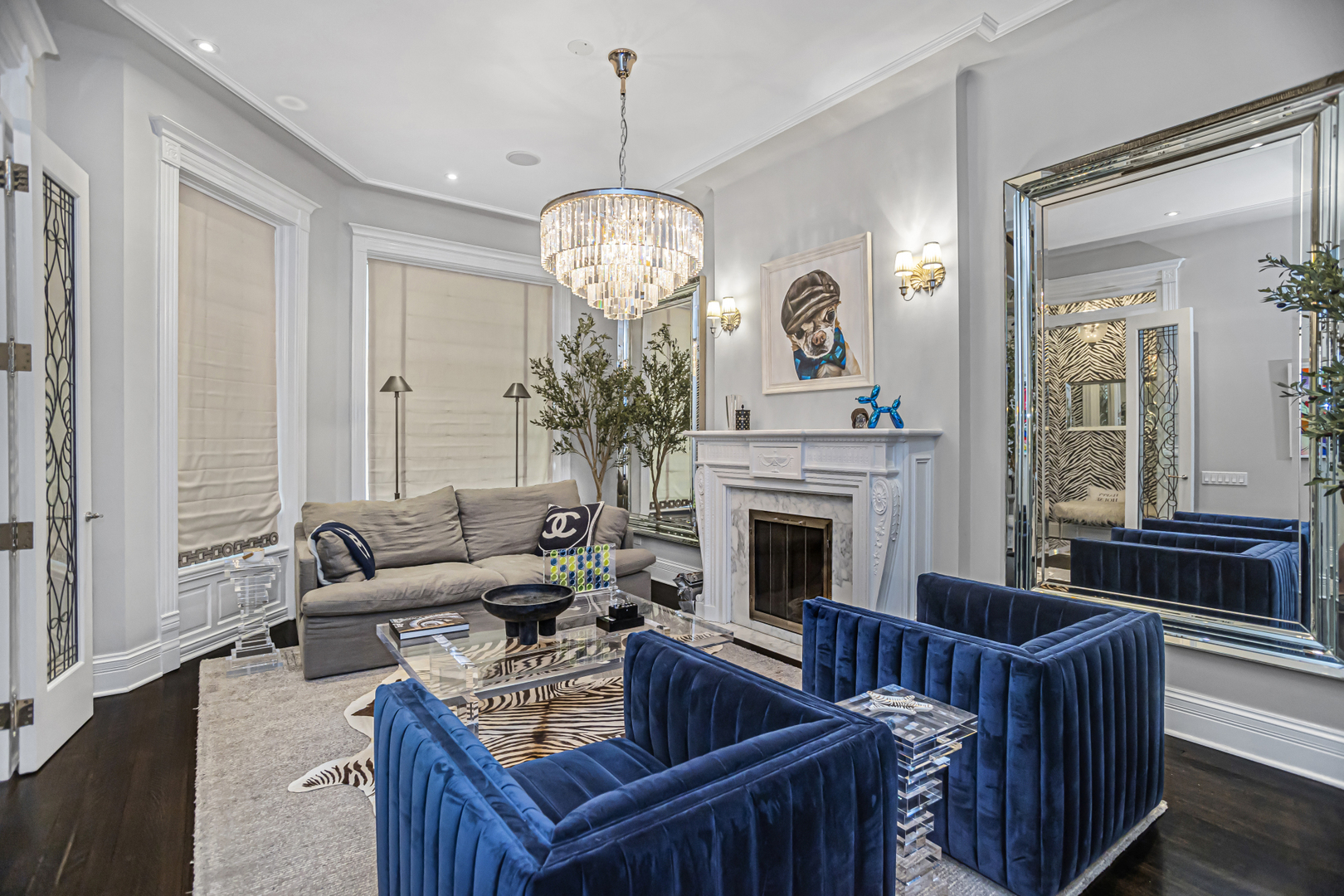 1302 North Ritchie Court Chicago, IL 60610 - Photo 5 of 31 a living room with furniture a chandelier and a fireplace