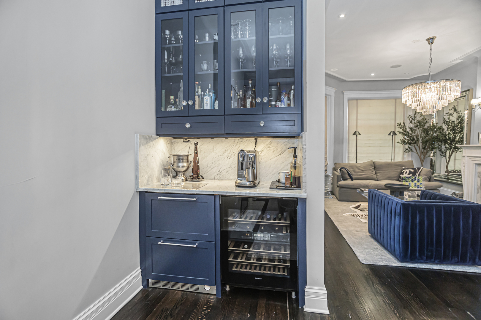 1302 North Ritchie Court Chicago, IL 60610 - Photo 7 of 31 a kitchen with a sink and wooden cabinets