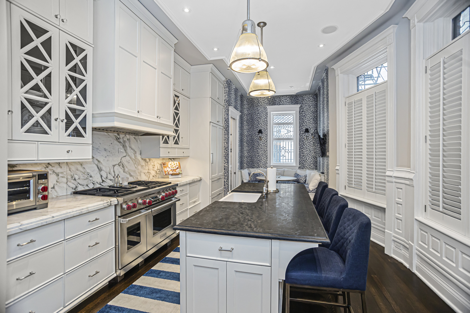 1302 North Ritchie Court Chicago, IL 60610 - Photo 8 of 31 a kitchen with stainless steel appliances granite countertop a stove a sink dishwasher and cabinets with wooden floor