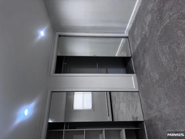 687 Probst Avenue Fairview, NJ 07022 - Photo 8 of 11 an empty room with closet and windows