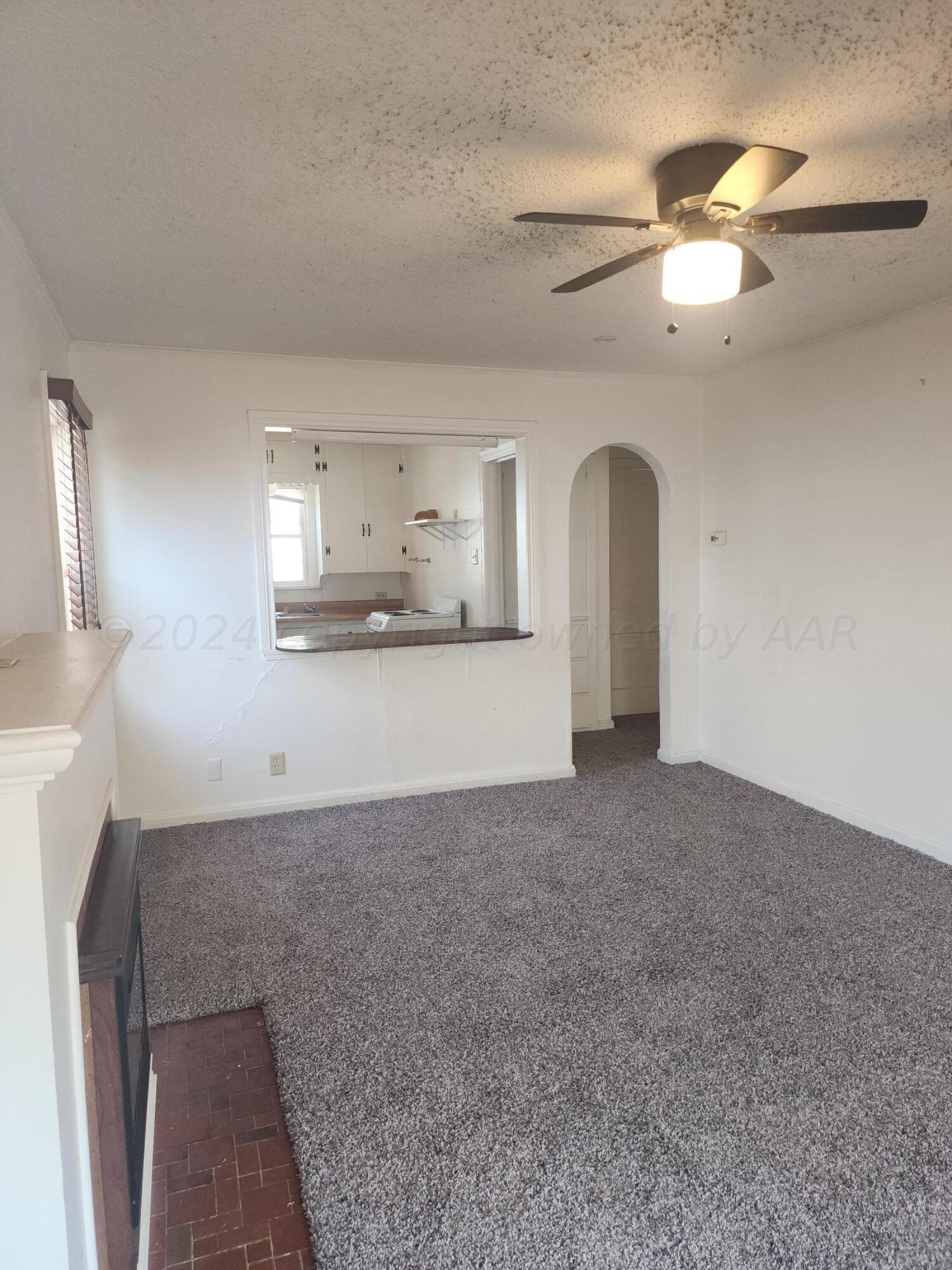 911 South Rusk Street Amarillo, TX 79102 - Photo 5 of 16 a view of a kitchen with a sink and a chandelier