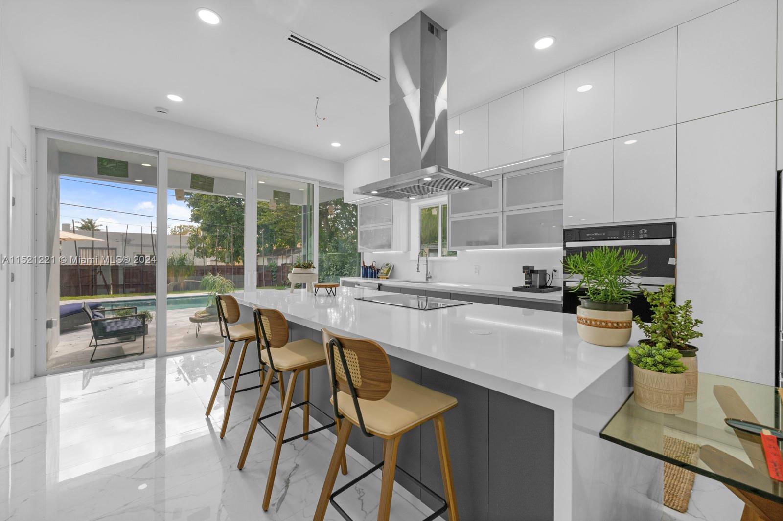 2356 Southwest 11th Street Miami, FL 33135 - Photo 16 of 51 a kitchen with a table and chairs in it