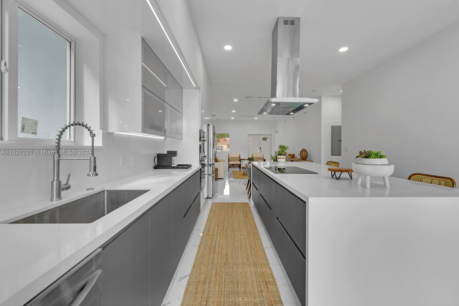 2356 Southwest 11th Street Miami, FL 33135 - Photo 18 of 51 a large kitchen with stainless steel appliances lots of counter space and a sink