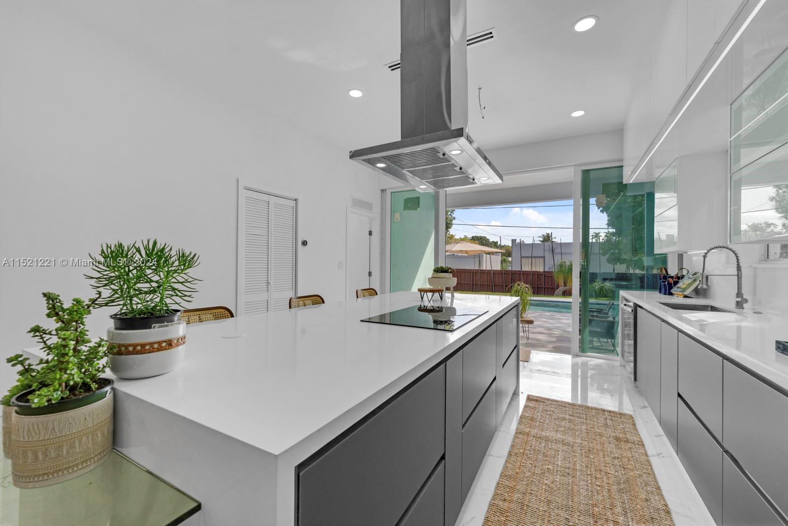 2356 Southwest 11th Street Miami, FL 33135 - Photo 20 of 51 a kitchen with sink and stove