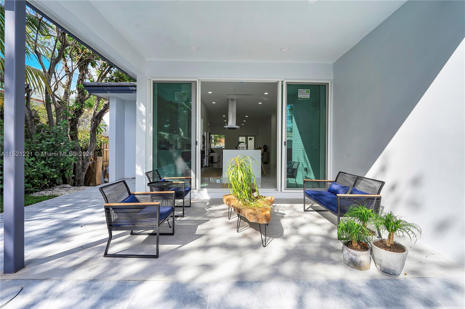 2356 Southwest 11th Street Miami, FL 33135 - Photo 21 of 51 a building outdoor space with furniture and potted plants