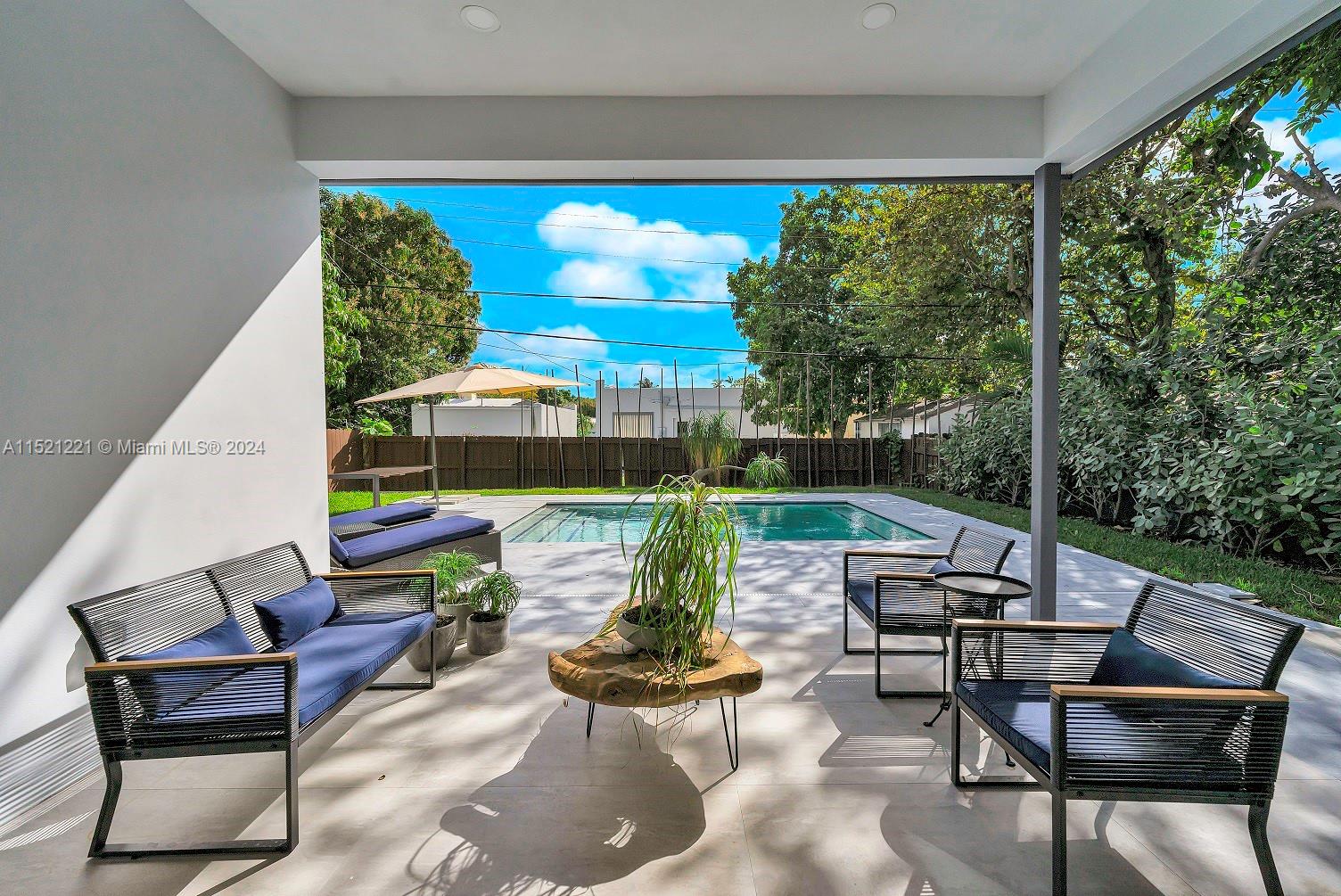 2356 Southwest 11th Street Miami, FL 33135 - Photo 23 of 51 a view of a patio with table and chairs potted plants with sky view