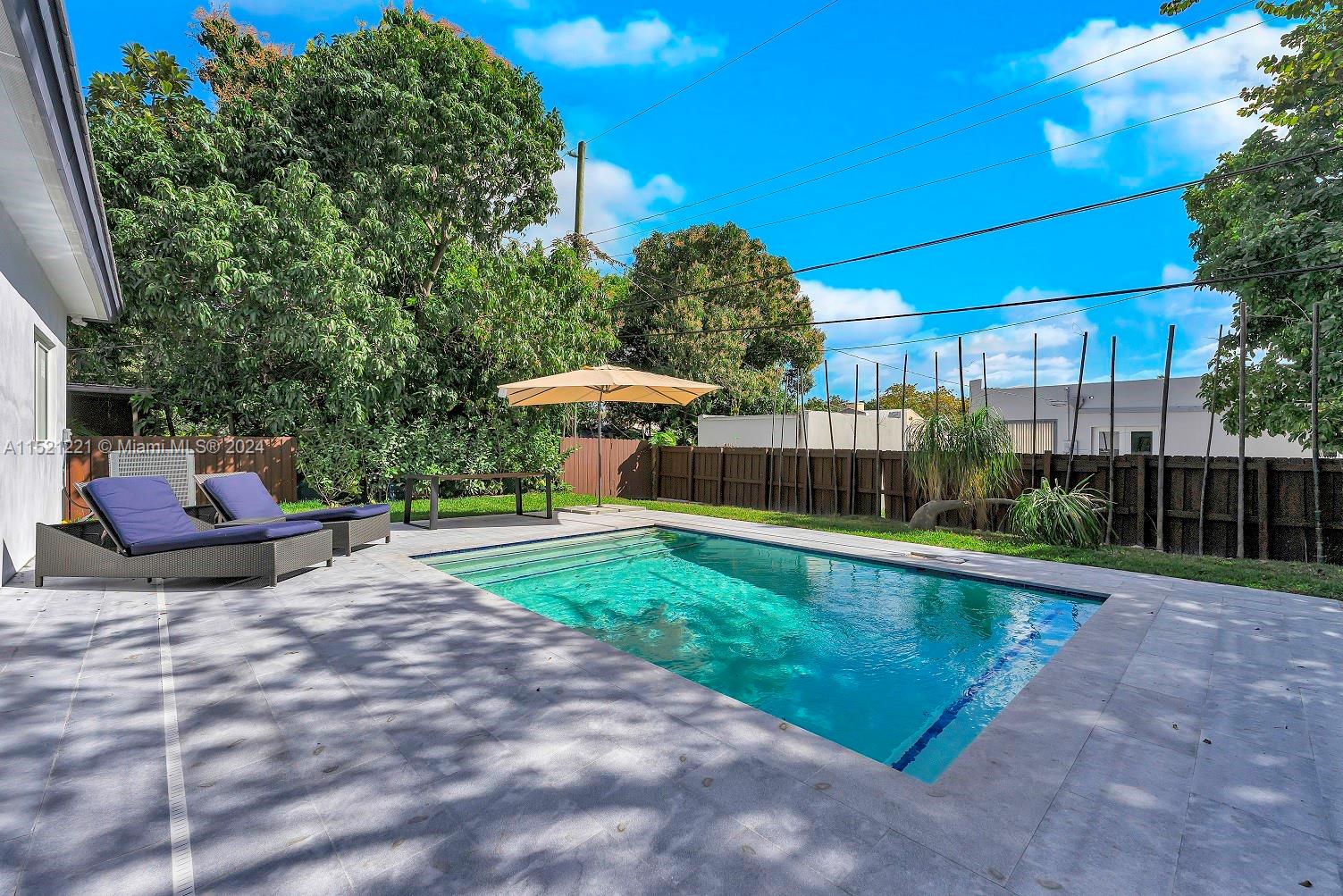 2356 Southwest 11th Street Miami, FL 33135 - Photo 24 of 51 a view of a swimming pool with a patio
