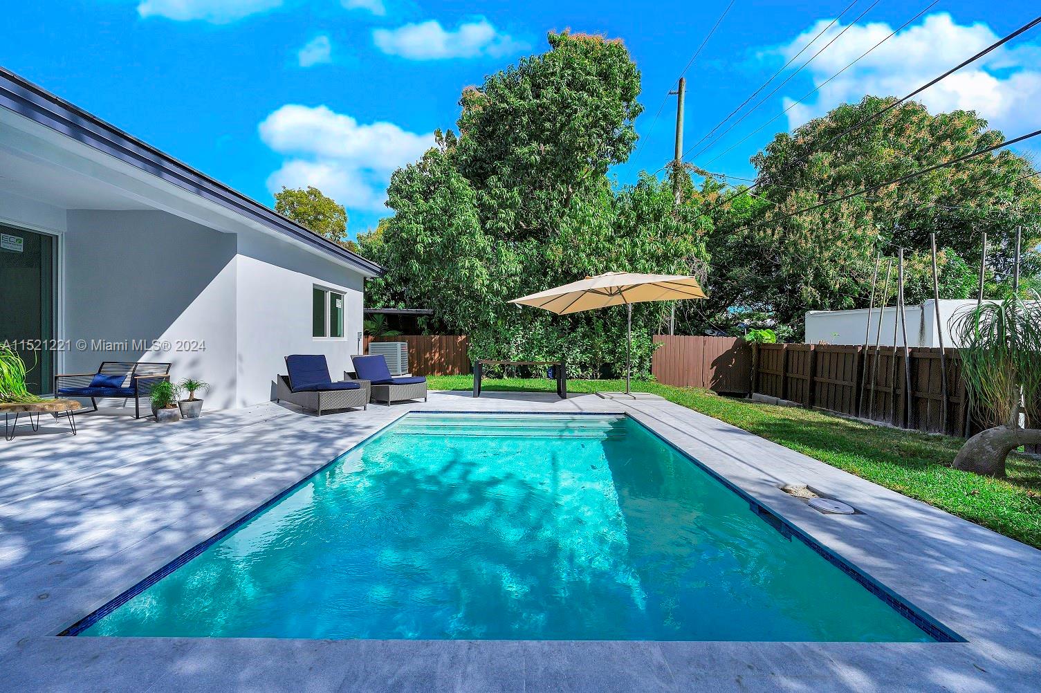 2356 Southwest 11th Street Miami, FL 33135 - Photo 25 of 51 a view of a swimming pool with a patio